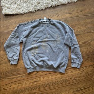 Grey crewneck with jaguars on it